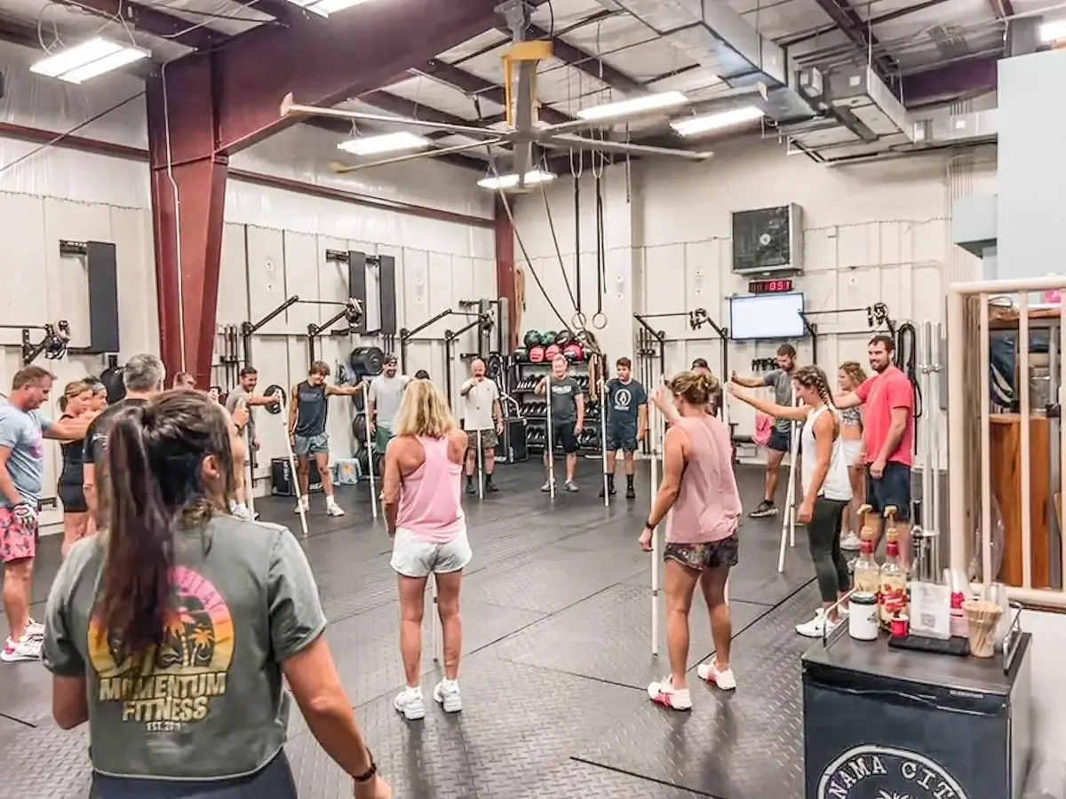 A coach briefing the class before the workout